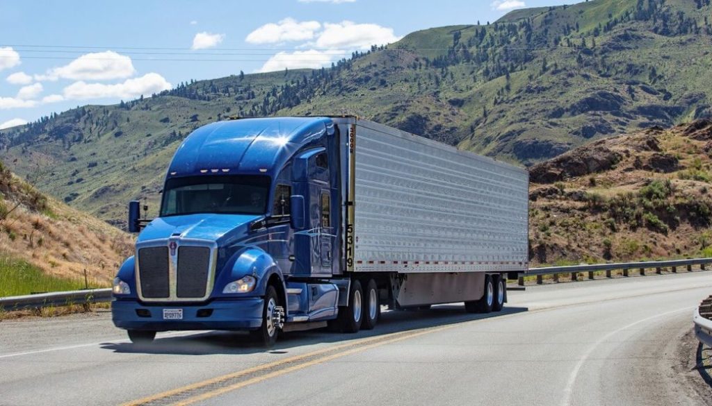 OAKLAND TRUCKING LLC tractor on the road